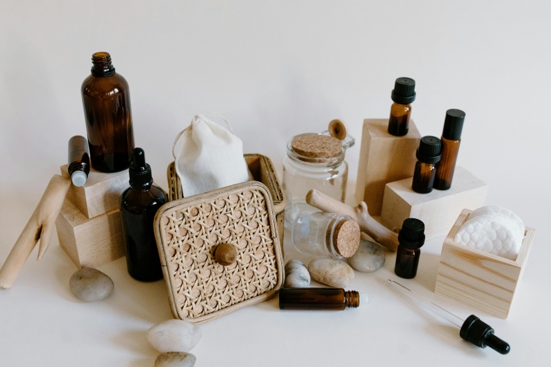 Brown essential Bottles on Wooden Blocks Essential Oils 101: Uses, Benefits, and Extraction Process www.manukaoil.com